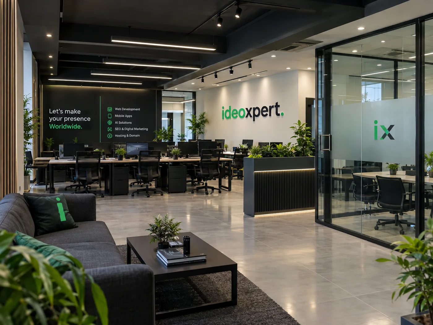 Inside the IdeoXpert office: desks, a glass meeting room and the logo on the wall